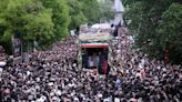 Thousands turn out as funeral procession begins for Iranian president
