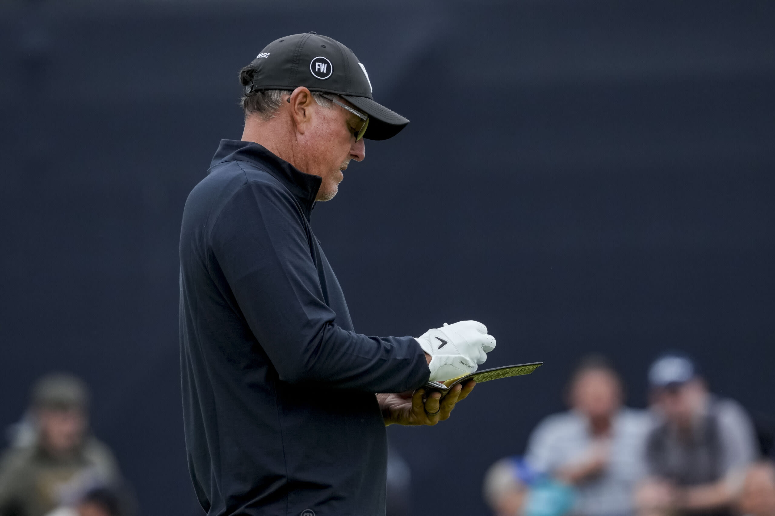 Phil Mickelson stops to speak to the press but refuses to engage at 2024 British Open