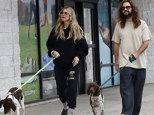 Heidi Klum keeps it casual in black sweatsuit with husband Tom Kaulitz as they walk their two German shorthaired pointers in LA