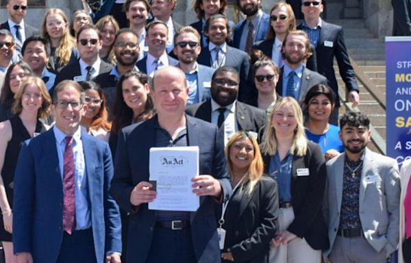 Gov. Jared Polis signs Colorado budget with focus on schools, public safety, housing