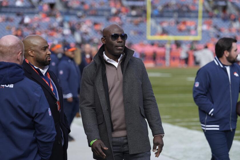 Terrell Davis says he 'tapped' flight attendant for ice. He ended up handcuffed at John Wayne Airport