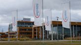 Infineon launches savings programme, lowers revenue outlook