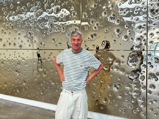 Gold and gunfire: Italian artist Cattelan's latest satirical work is a bullet-riddled golden wall