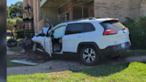 Photo: A man is in custody after a wild police chase ends with car lodged against apartment building