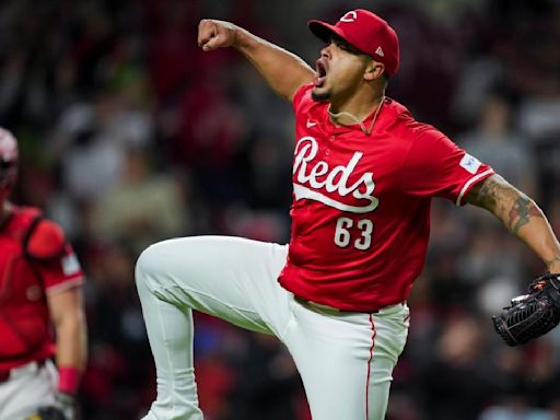 Santiago Espinal has 3 RBIs, Fernando Cruz pitches out of another jam and Reds beat Phillies 7-4