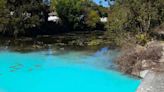 Mystery behind why a creek suddenly turned electric blue