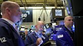 Wall St drops as Treasury yields surge, Powell speaks