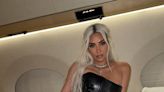 Kim Kardashian Wears A Leather Corset Gown On A Private Jet