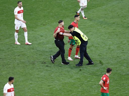 ‘It is a concern, today we were lucky”: Martinez calls for fans to stay in stands as pitch invaders swarm Ronaldo