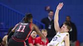 Blue Hens lose starter at last minute, win basketball game with late shots