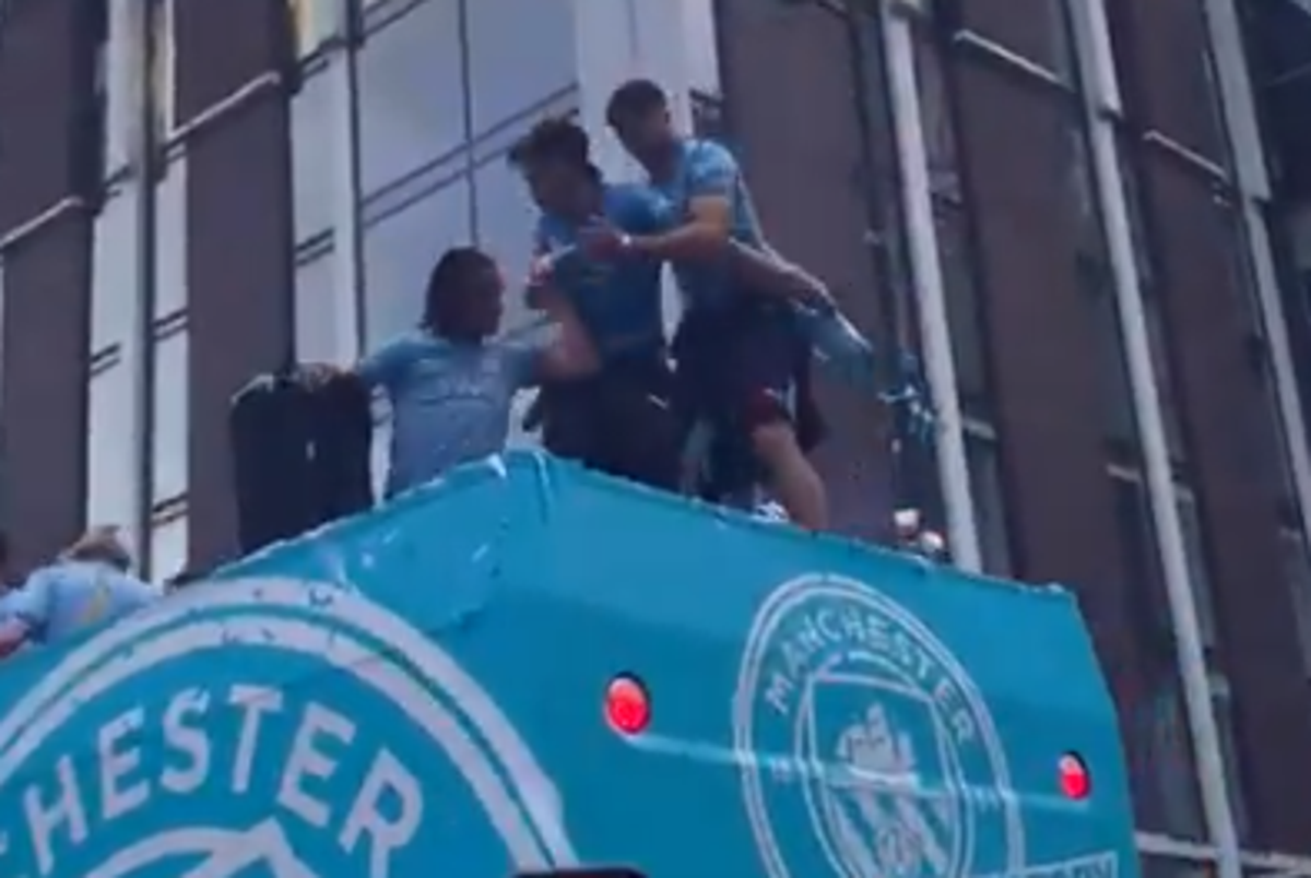 Watch: Jack Grealish nearly falls off bus TWICE during Man City title parade