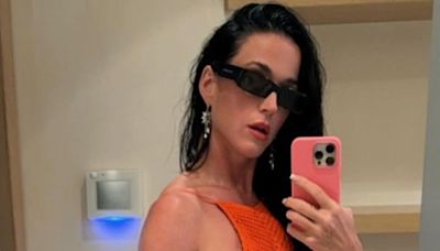 Katy Perry looks like an alien on the beach in iridescent rubber rings look