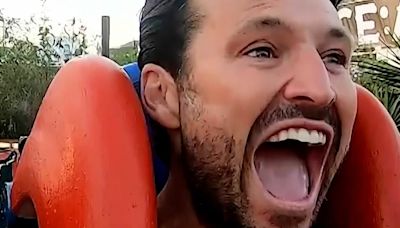 Mark Wright screams as he takes DJ Toby Anstis on slingshot ride