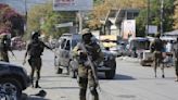 US forces fly in to beef up security at embassy in Haiti and evacuate nonessential personnel