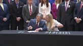 Governor applauds GA first lady as he signs 9 new laws to combat human trafficking