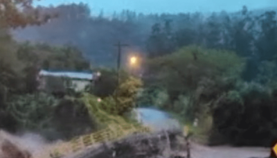 Bridge washes away on video as mayor warns of floods