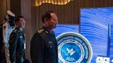 Chinese general takes a harsh line on Taiwan and other disputes at an international naval gathering