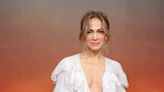 JLo wears metallic dress tied together with huge velvet bows