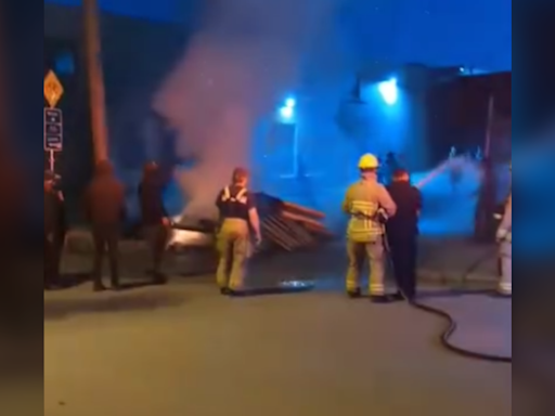 Video shows police officer taking firefighter's hose, spraying people in East Vancouver