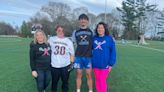 Two local moms battling breast cancer honored at their son's lacrosse game