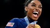 Triumphant Simone Biles leads USA to Olympic gymnastics team gold