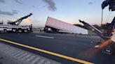 Semi-truck hangs off overpass after crash on Polk Parkway East