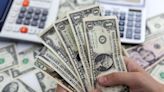 Dollar falls to nine-month low as Powell notes progress in disinflation