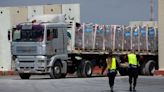 Trucks bringing bodies and detainees into Gaza hold up aid says UNRWA