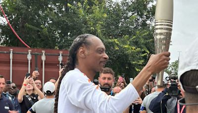 Crowds cheer as Snoop Dogg carries Olympic torch for Paris 2024 Games