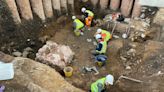 Evidence of Roman shrine uncovered during archaeological dig in graveyard