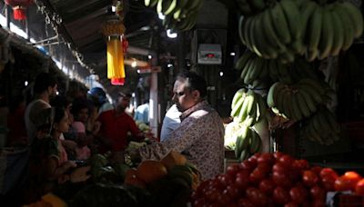 India's retail inflation reignites in June as food prices surge