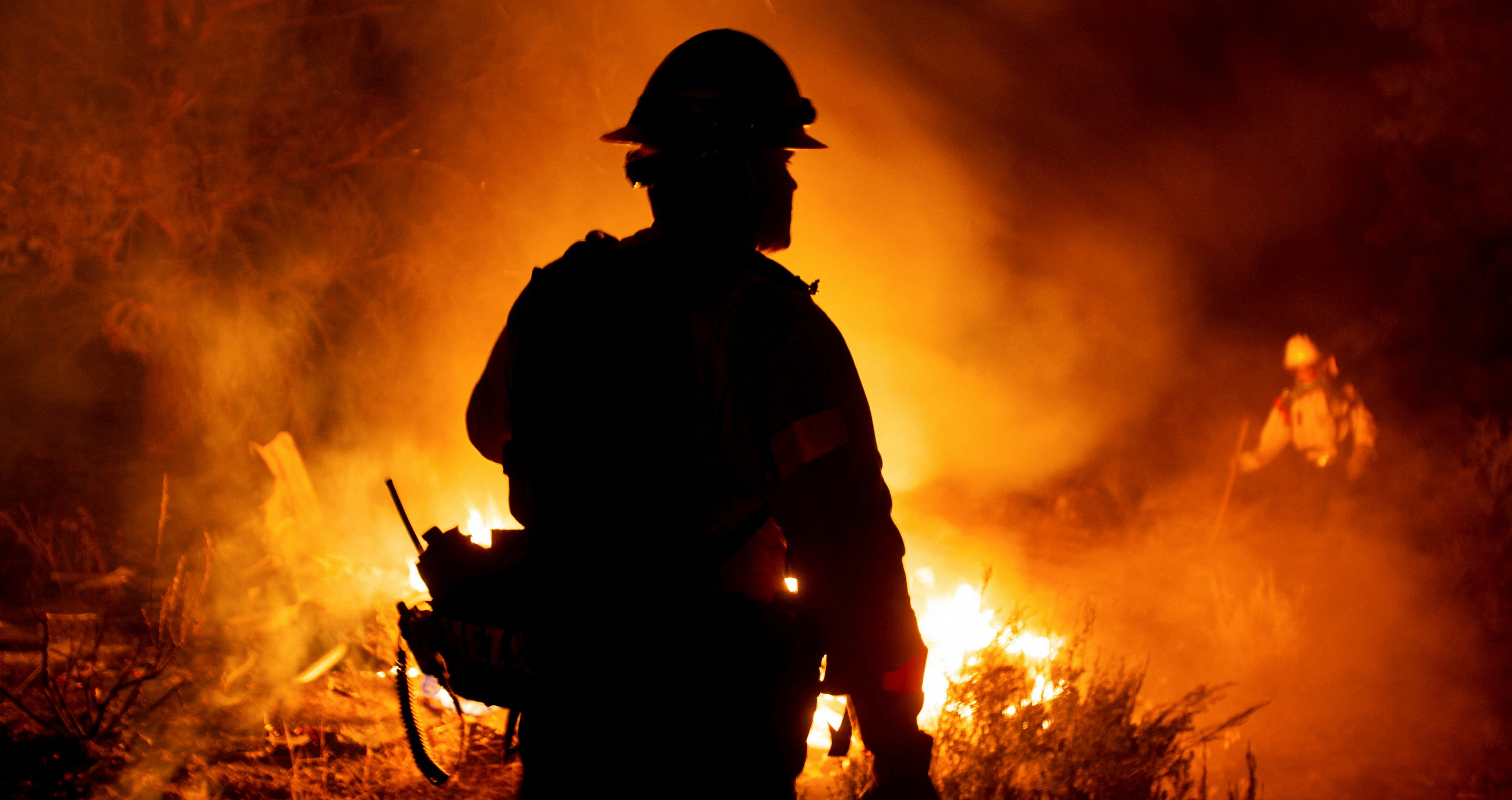 Photos show Bridge, Airport and Line wildfires raging in Southern California, torching dozens of homes and forcing thousands to evacuate