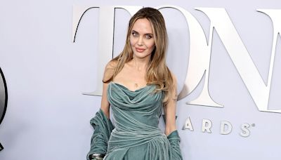 Angelina Jolie reveals new chest tattoo at Tony Awards