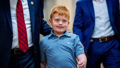 WATCH: Congressman's Son Makes Funny Faces Behind Dad During Floor Speech | iHeart