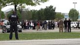 Wilmer-Hutchins High School students stage a walkout following Friday's shooting at the school