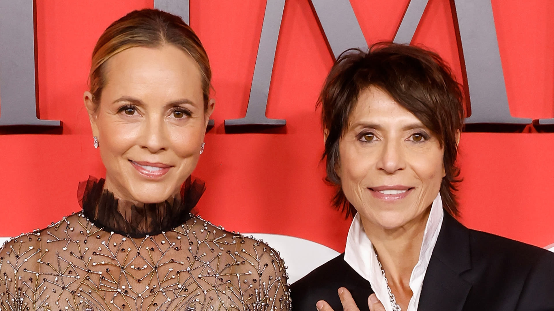 Maria Bello, 56, and star chef Dominique Crenn pose with wedding rings