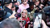 Marjorie Taylor Greene is taunted by fellow Trump fanatic at arrest rally