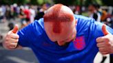 Barber who shaved St George cross into his hair among fans in Berlin