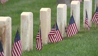 Thousands of American flags are placed on gravesites at Miramar National Cemetery