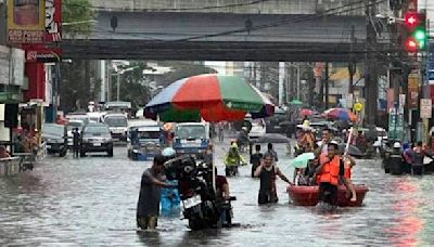 A typhoon kills 3 as it nears Taiwan. It killed 13 in the Philippines, where people plead for rescue