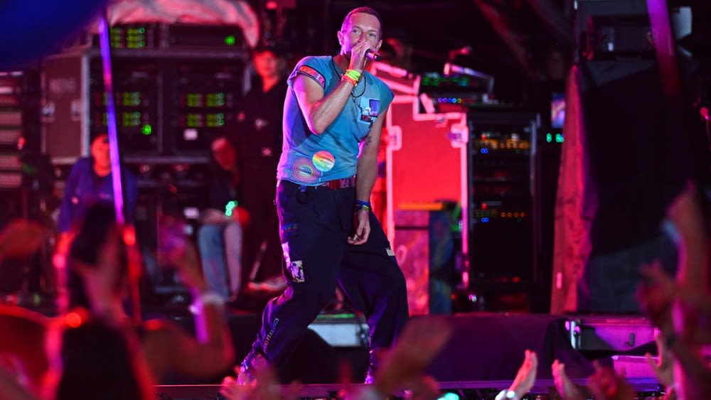 Michael J. Fox Joins Coldplay on Guitar During Glastonbury Headlining Set, Little Simz Makes Appearance to Debut New Song