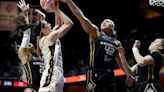 The Connecticut Sun's Brionna Jones blocks a shot by the Indiana Fever's Caitlin Clark during the fourth quarter at Mohegan Sun Arena on Tuesday...
