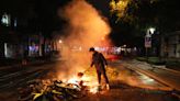 Violent clashes break out in Paris after shock exit poll results in France’s general election