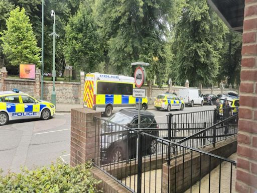 Residents describes dramatic moment police raid block of flats while he works