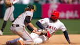 Orioles hold off Angels by throwing out base stealer. Trout becomes 1st in majors to reach 10 homers