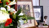 Flowers adorn a spot in the historic locker room next to pictures of late Hall of Fame baseball player Willie Mays before the game between the St. Louis Cardinals and the San Francisco...