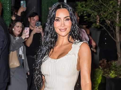 Kim Kardashian shows off her curves in tight latex dress