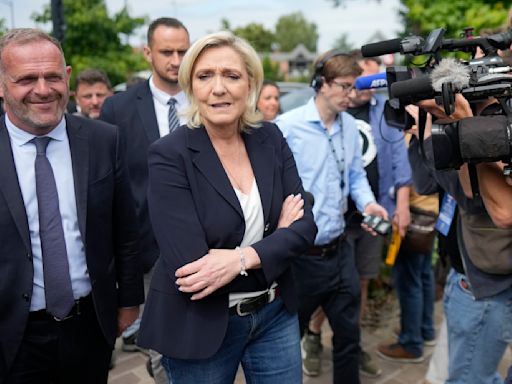 The Latest | Projections show far-right National Rally has strong lead in France's 1st voting round