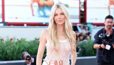 Sienna Miller goes braless in a racy sheer white jumpsuit