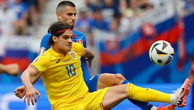 Hagi wins penalty as Romania win group